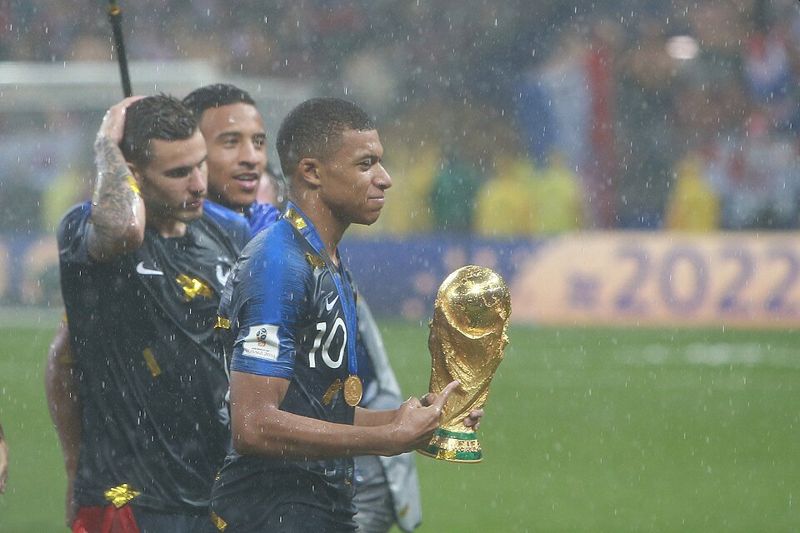 Kylian Mbappé with the World Cup in 2018
