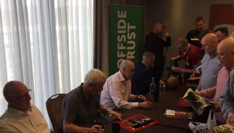 Terry Mcdermott signing autographs at an LFC function
