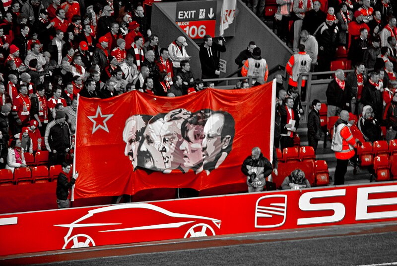 flag showing european cup winning managers on the kop monochrome only showing red