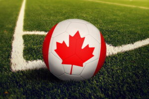 football pained with canada flag close up on corner spot