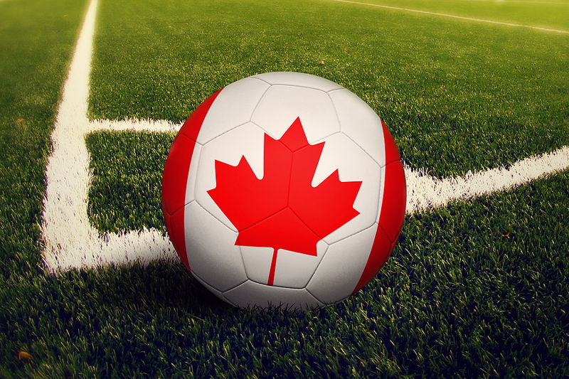 football pained with canada flag close up on corner spot