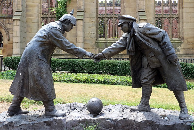 statue of truce to play football from world war one