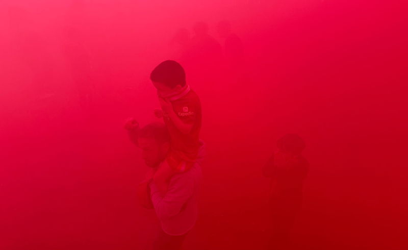 thick smoke from red flares liverpool fc league win 2025