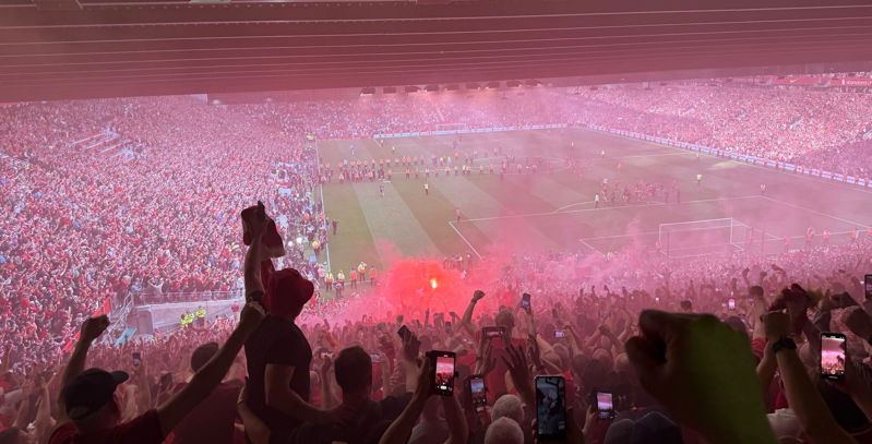 view from kop fans singing red flares after liverpool win league against spurs 2025