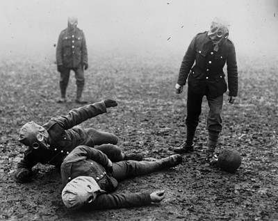 world war one soldiers play football in gas masks